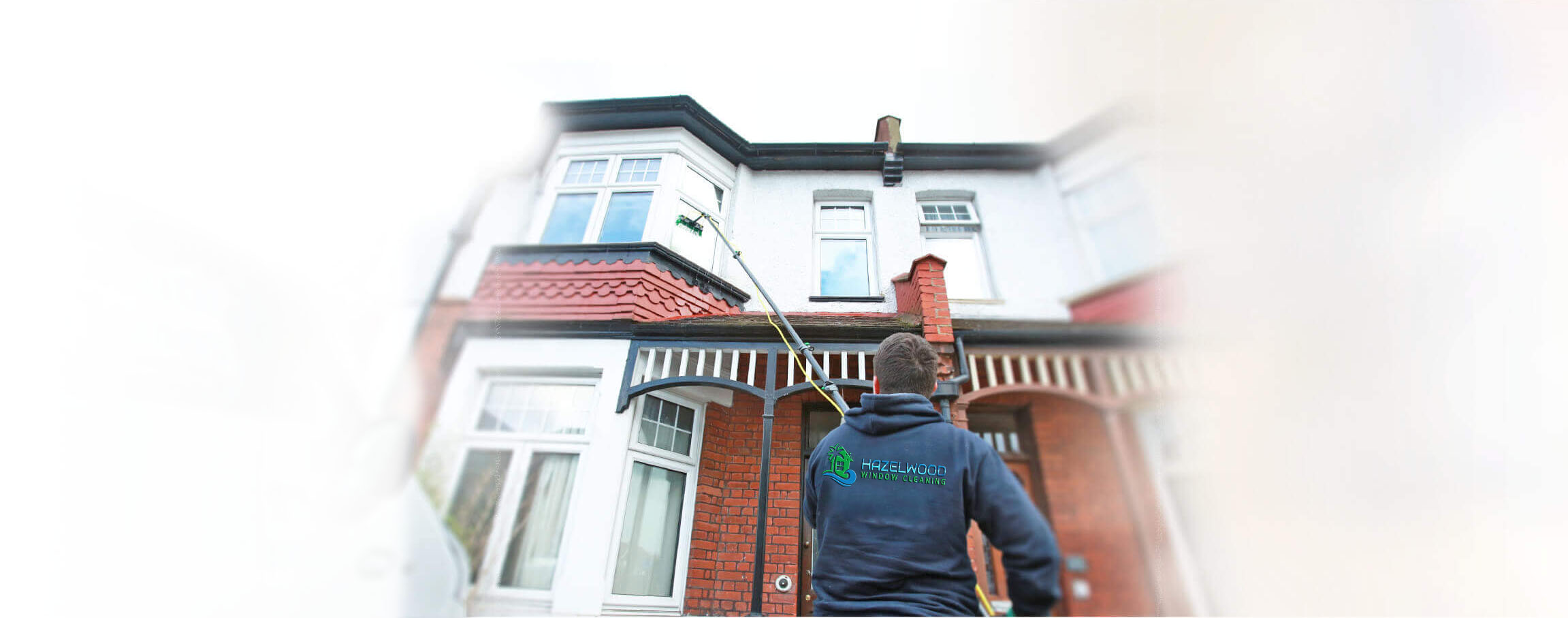Hazelwood Window Cleaning at work using a water-fed pole